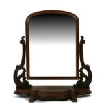 A Victorian walnut Duchess toilet mirror with scroll supports and shaped box base, on scroll feet,