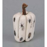 An ivory okimono in the form of a pepper with fifteen shibayama inset decorations, 8cms high.