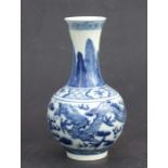 A Chinese blue & white baluster vase decorated with dragons chasing a flaming pearl amongst