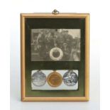 A WWI Royal Navy trio medal group awarded to 'S.S. 8565 W R Wills ORD R.N' mounted in a presentation