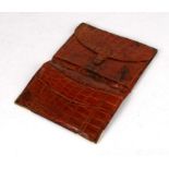 An Asprey of London crocodile leather gentleman's wallet with 9ct gold corners, London 1941, 17cms