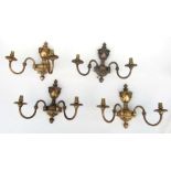 A set of four gilded twin-arm Adams style wall lights, 24cms high.