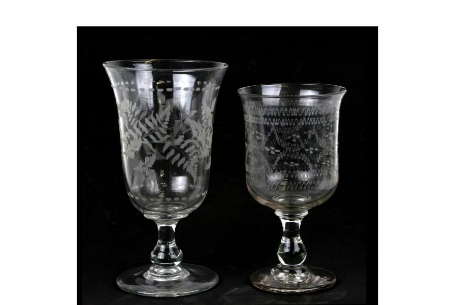 An 18th century style glass footed celery vase with engraved fern decoration, 23cms high; together