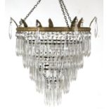 A five-tier crystal drop chandelier, 31cms diameter.Condition ReportA couple of drops are missing,