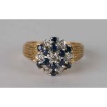 An 18ct gold diamond and sapphire cluster ring,approx.UK size O. 5.3g