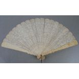 A Chinese Cantonese double sided ivory brise fan, the guards with heavily carved decoration.