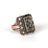 A Georgian continental yellow coloured metal and silver armorial shield ring dated 1806.