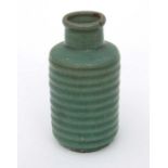 A Chinese celadon glaze crackleware ribbed vase, 17cms high.