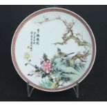 A Chinese Republic style dish decorated with birds, flowers and calligraphy, red seal mark to the