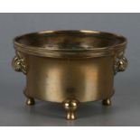 A Chinese polished bronze censer with animal mask handles, six character mark to base, 11cms