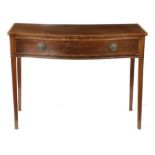 A George III mahogany serpentine side table in the manner of Gillows, the top with satinwood