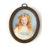 A Victorian oval bust portrait miniature of a young girl, watercolour on ivory, in a brass oval