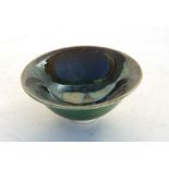 A Hugh Wallace Pottery lustre footed bowl, 9cms diameter.