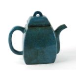 A Chinese turquoise glazed Yizing teapot with impressed seal mark to the underside.