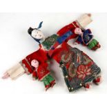A Chinese opera doll in dragon robe, approx 20cms high; together with two similar dolls (3).