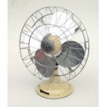 A Veritys Fans Ltd cream painted Limit fan with chrome plated blades, 35cms high.