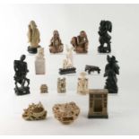 A group of Chinese soapstone figures to include scholars, an emaciated monk and a fo dog seal; and