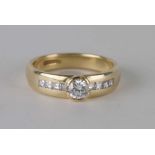 An 18ct gold diamond ring, the large central diamond with eight square cut diamonds to the