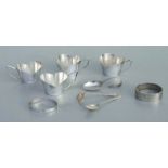Two silver bangles; a silver caddy spoon; together with four white metal cups; and other items.