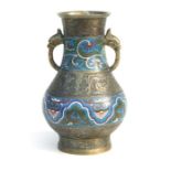 A Chinese brass and enamel two-handled vase of baluster form, 31cms high.