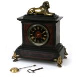 A Victorian Egyptian Revival black slate and marble mantle clock, the black dial with Roman