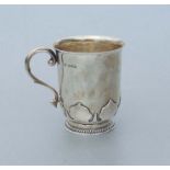 A silver christening tankard, Birmingham 1927 and maker's mark for 'Adie Bros', 9cms high, 220g.