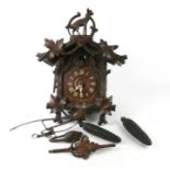 A Black Forest cuckoo clock, 36cms wide.