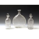 A pair of 19th century square from moulded glass decanters, 21cms high; together with a moulded
