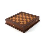 A Hillwood of London chess set in a burr walnut box, 31cms wide.