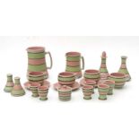 A Langley Pottery Domino pattern part dinner service to include graduated jugs, a set of six
