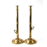 A pair of tall Georgian brass ejector candlesticks 51cms high.Condition ReportNo damage or repair to