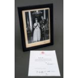 A signed black & white photograph of Queen Elizabeth II and Prince Philip, dated 1963, in original