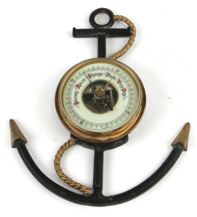 A West German nautical themed wall barometer, overall 23cms high.