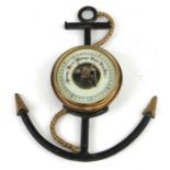 A West German nautical themed wall barometer, overall 23cms high.