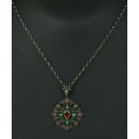 A late Victorian Austrian / Hungarian garnet & green stone set silver pendant and chain.