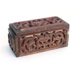 A Chinese red lacquer and gilt carved wood box decorated with stylised dragons, 35cms wide.Condition