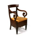 A 19th century mahogany commode chair.