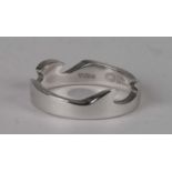 A Georg Jensen 18ct white gold wavy band ring, approx UK size 'R', 6.3g.
