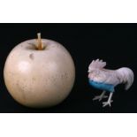 A Japanese ivory okimono in the form of an apple with signature to the underside, 6cms high;