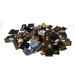 A large quantity of military cloth badges.