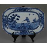 An 18th century Chinese blue & white dish decorated with a hunting scene with man with musket and