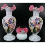 A pair of Victorian glass vases of baluster form with fold rims and hand painted decoration