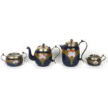 An Art Nouveau four-piece enamel tea and coffee set decorated with McIntosh design of roses with