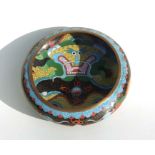 A Chinese cloisonne bowl decorated with a dragon chasing a flaming pearl on a black ground, 25cms