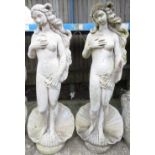 ARCHITECTURAL SALVAGE - PAIR OF RECONSTITUTED STONE STAUE OF A FEMALES STANDING ON A CARVED SHELL