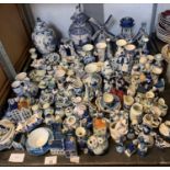 LARGE QUANTITY OF DUTCH DELFTWARE TO INCLUDE MODELS OF WINDMILLS, CLOGS, VASES ETC