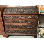 HEAVILY CARVED MAHOGANY BUREAU