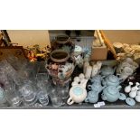SHELF OF ITEMS INCLUDING GLASSWARE, TEAPOTS, CUPS AND SAUCERS, CRUETS ETC