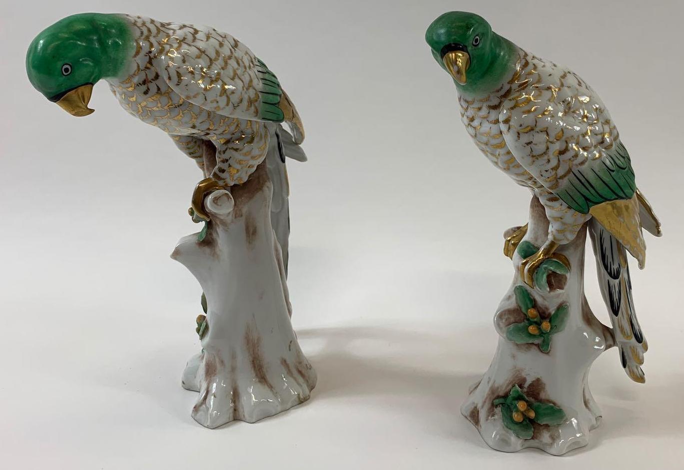 A pair of 19th century ceramic figures of birds, each painted with gilded and green highlights