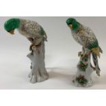 A pair of 19th century ceramic figures of birds, each painted with gilded and green highlights